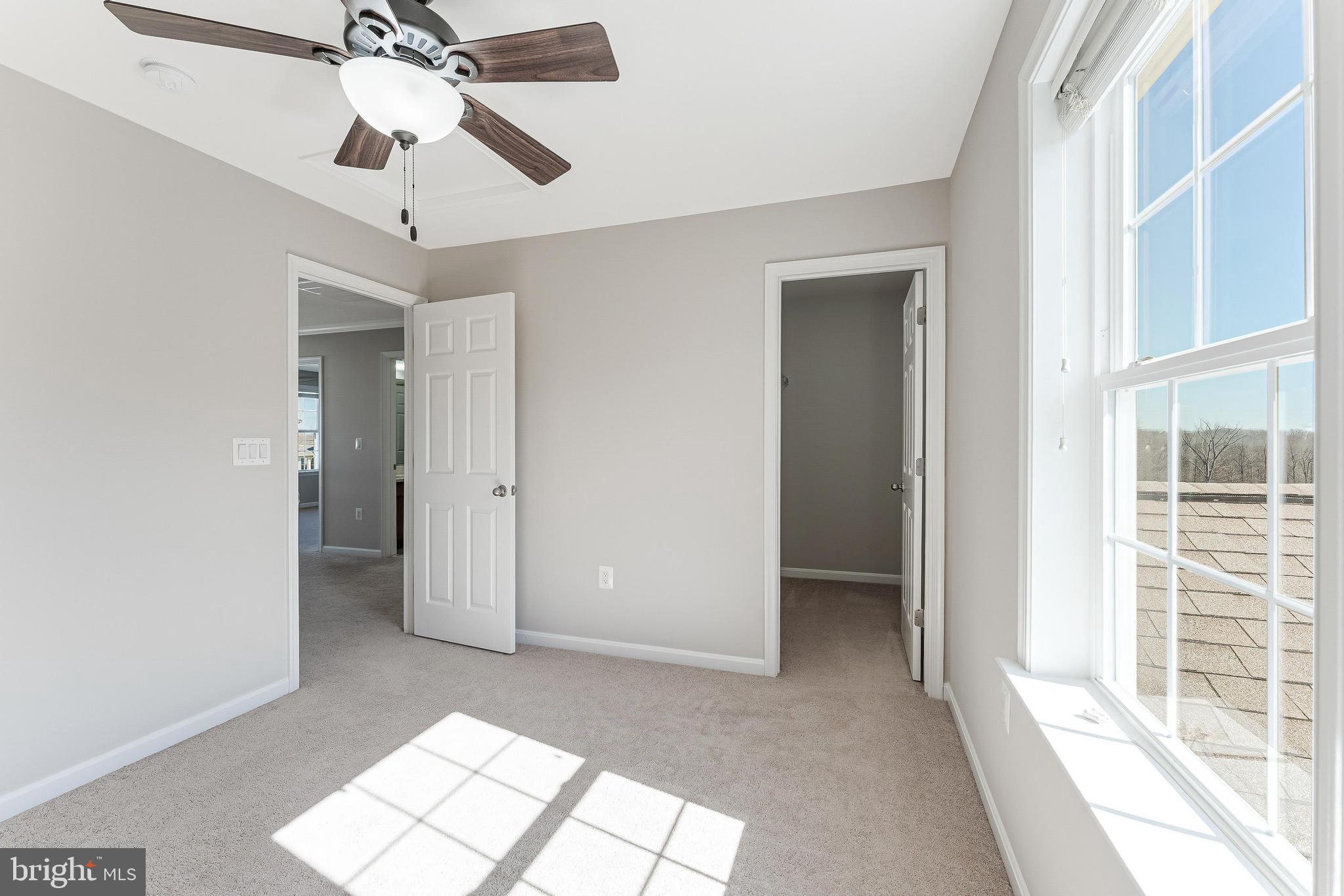 18747 Pier Trail Drive Triangle, VA 22172 - Photo 61 of 84 a view of livingroom with a ceiling fan and window
