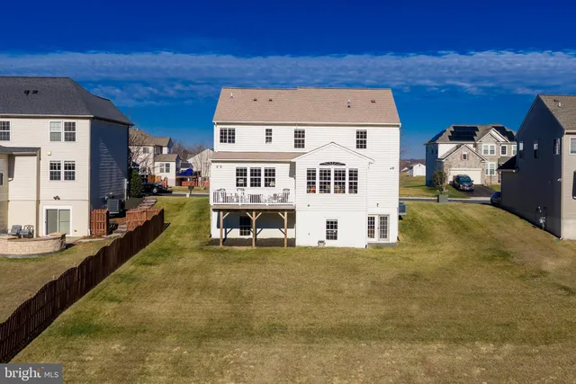 a view of pool with seating area