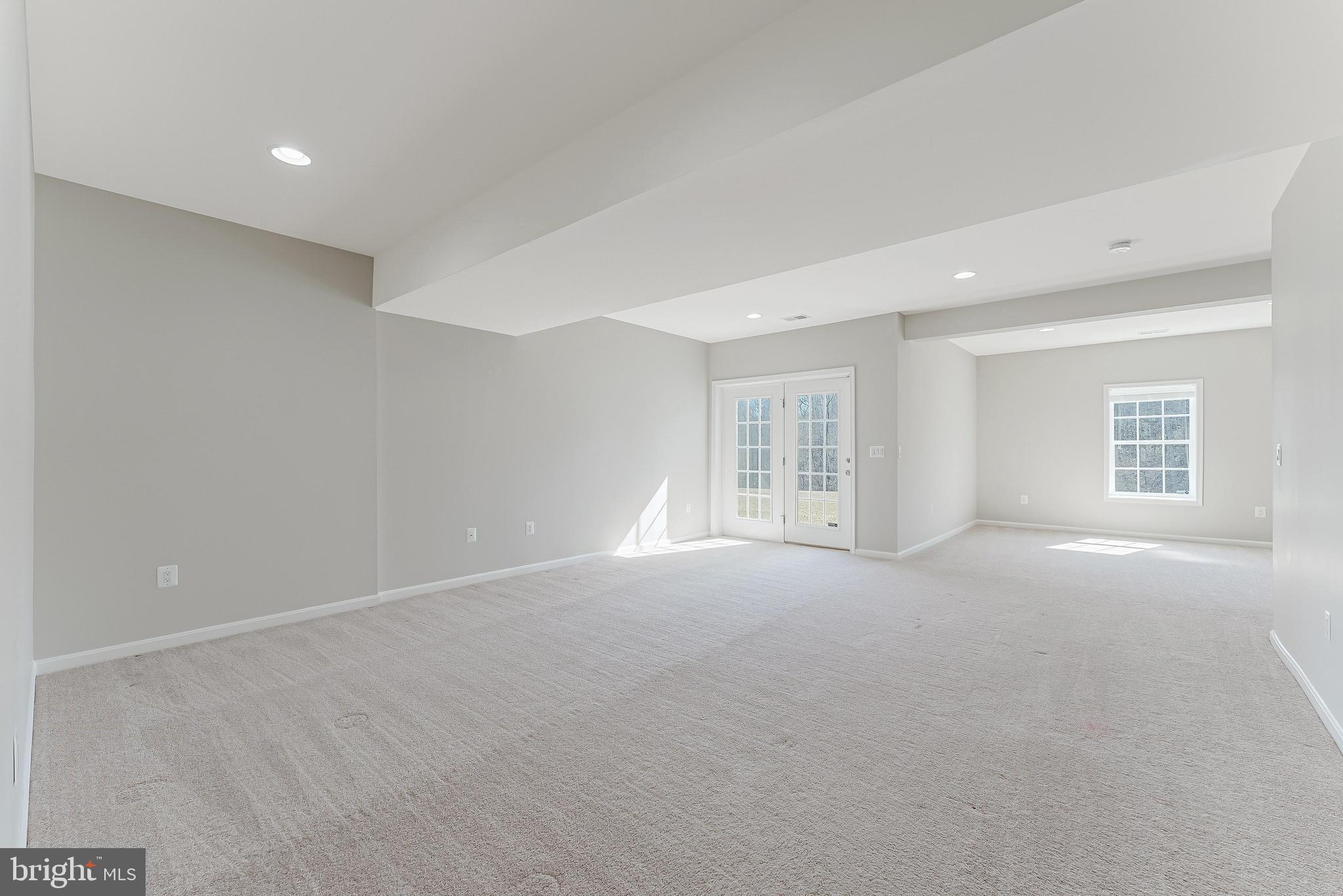 18747 Pier Trail Drive Triangle, VA 22172 - Photo 73 of 84 a view of a big room with windows and chandelier fan