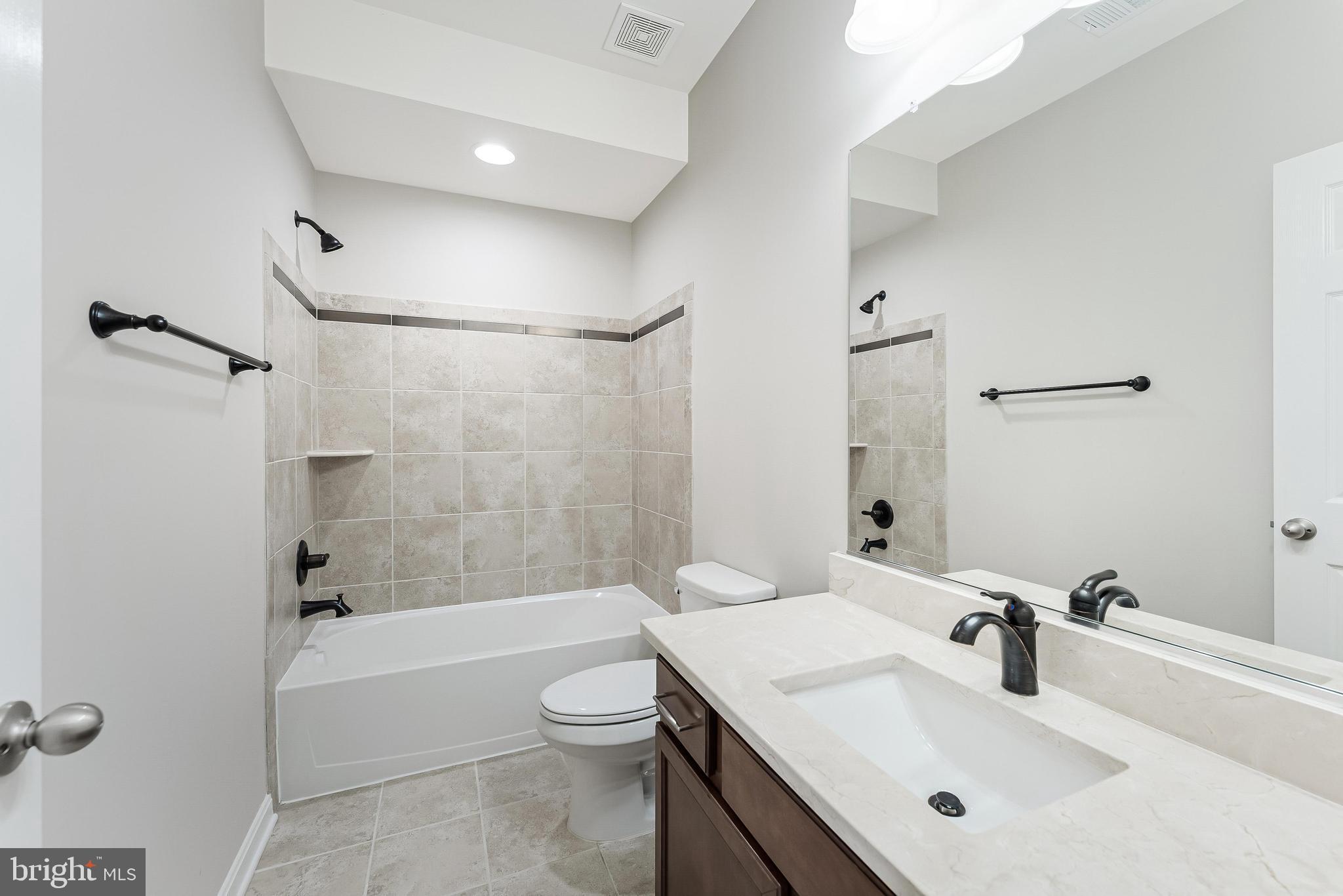 18747 Pier Trail Drive Triangle, VA 22172 - Photo 78 of 84 a bathroom with a sink toilet tub and shower