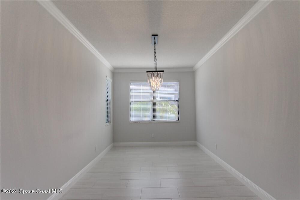 3267 Addison Drive Melbourne, FL 32940 - Photo 12 of 37 an empty room with a window