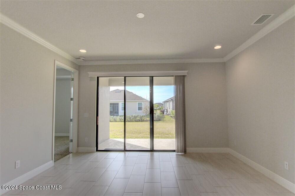 3267 Addison Drive Melbourne, FL 32940 - Photo 14 of 37 an empty room with sliding glass door and shower
