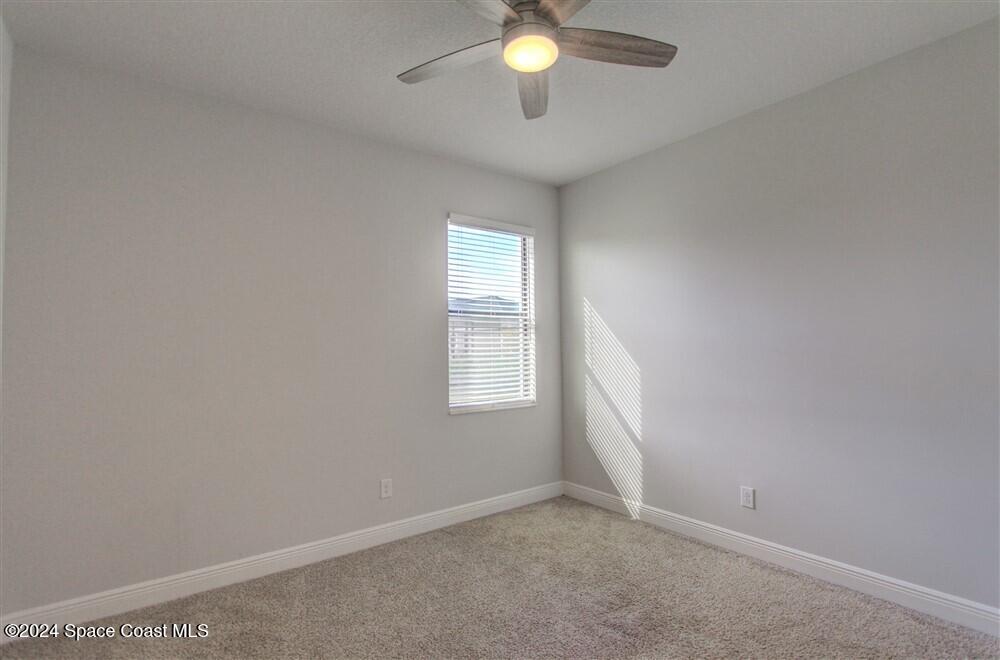 3267 Addison Drive Melbourne, FL 32940 - Photo 16 of 37 an empty room with a window