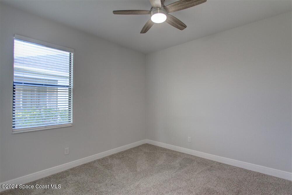 3267 Addison Drive Melbourne, FL 32940 - Photo 19 of 37 an empty room with a window