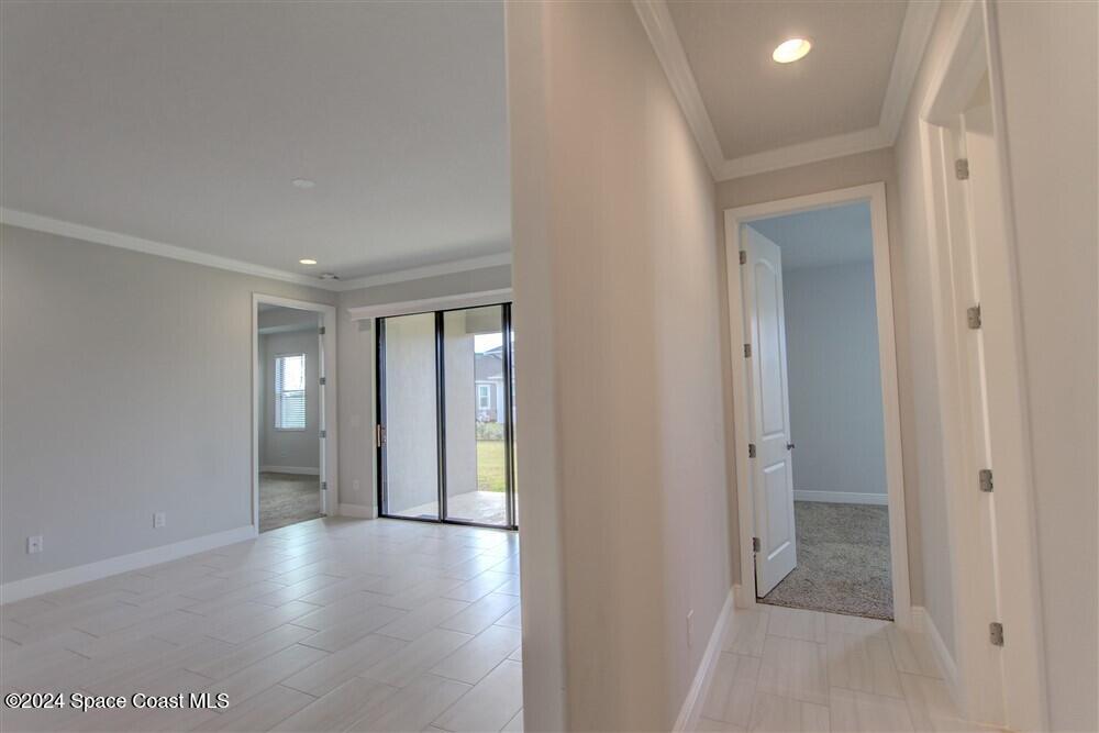 3267 Addison Drive Melbourne, FL 32940 - Photo 20 of 37 a view of a hallway with wooden floor
