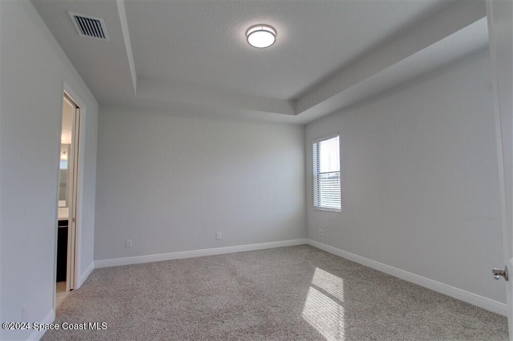 3267 Addison Drive Melbourne, FL 32940 - Photo 22 of 37 an empty room that has a window