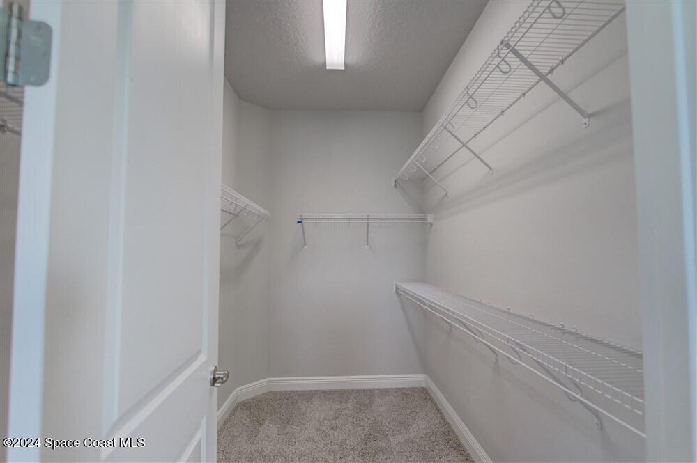 3267 Addison Drive Melbourne, FL 32940 - Photo 23 of 37 a view of a room with racks on the wall