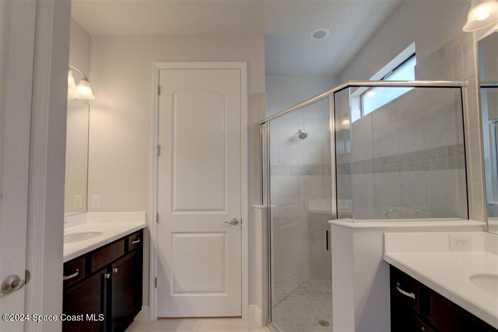 3267 Addison Drive Melbourne, FL 32940 - Photo 25 of 37 a bathroom with a shower and a sink