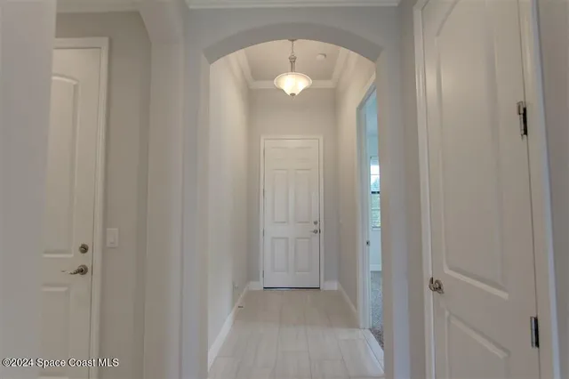 a view of a hallway with front door