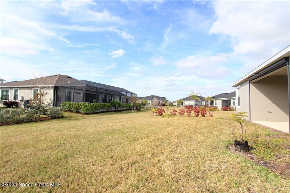 3267 Addison Drive Melbourne, FL 32940 - Photo 33 of 37 a view of a house with a yard