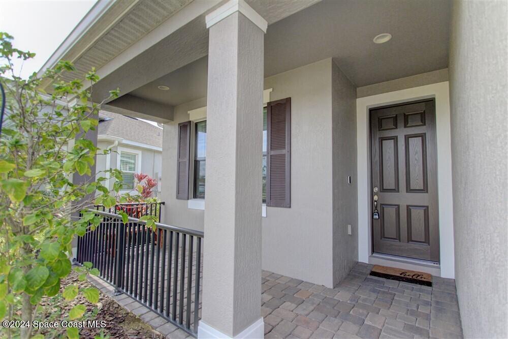 3267 Addison Drive Melbourne, FL 32940 - Photo 34 of 37 a view of a porch with wooden floor and fence