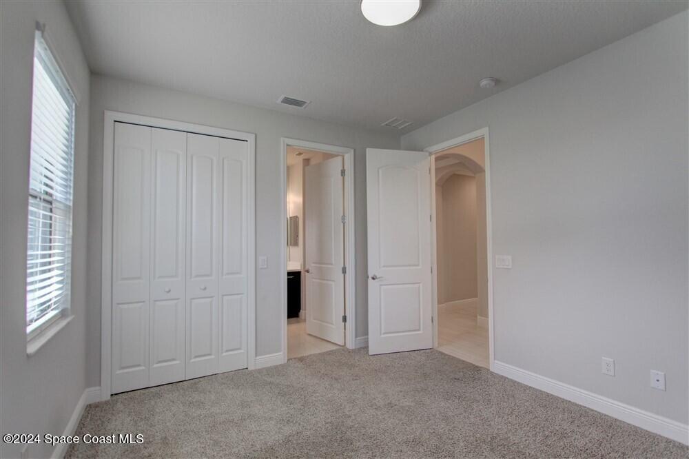 3267 Addison Drive Melbourne, FL 32940 - Photo 5 of 37 an empty room with windows