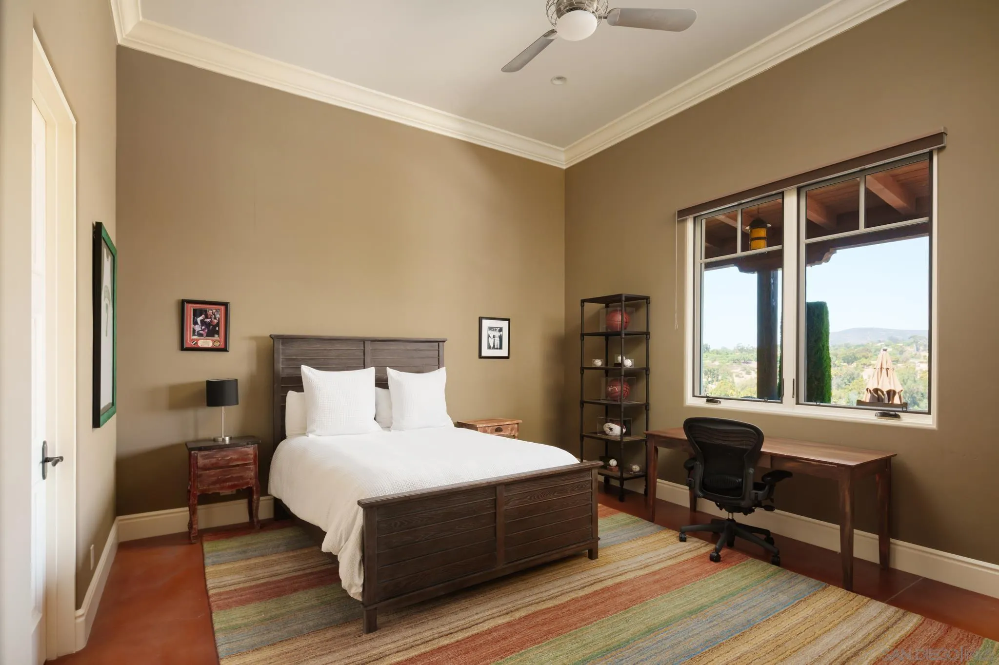 6248 Strada Fragante Rancho Santa Fe, CA 92091 - Photo 16 of 38 a bedroom with a bed wooden floor and window