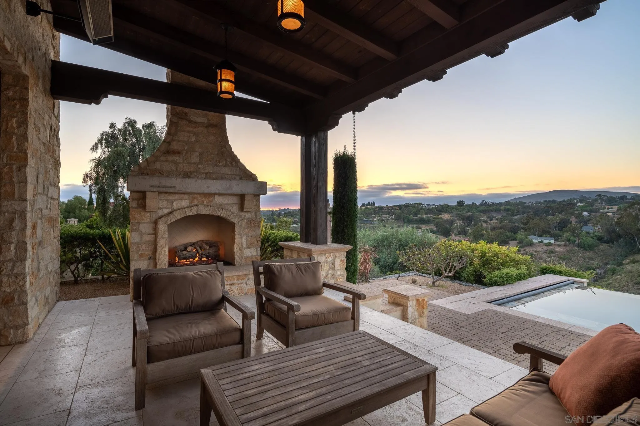 6248 Strada Fragante Rancho Santa Fe, CA 92091 - Photo 37 of 38 a balcony with furniture and a fireplace