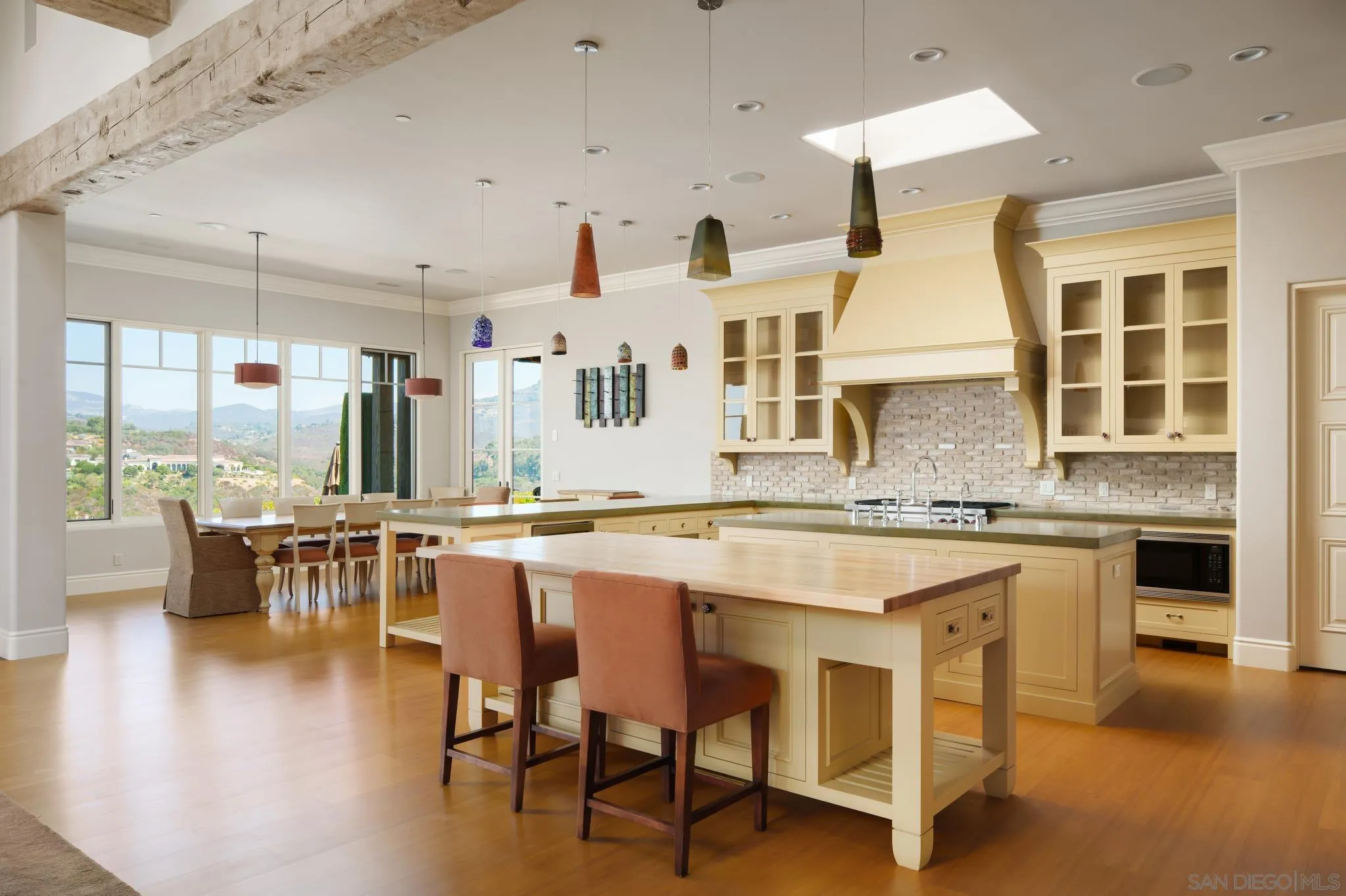 6248 Strada Fragante Rancho Santa Fe, CA 92091 - Photo 4 of 38 a kitchen with lots of counter top space and painting on the wall