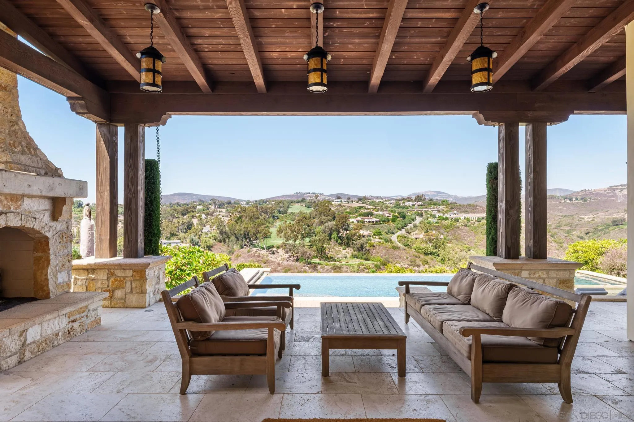 6248 Strada Fragante Rancho Santa Fe, CA 92091 - Photo 7 of 38 a living room with furniture a fireplace and a large window
