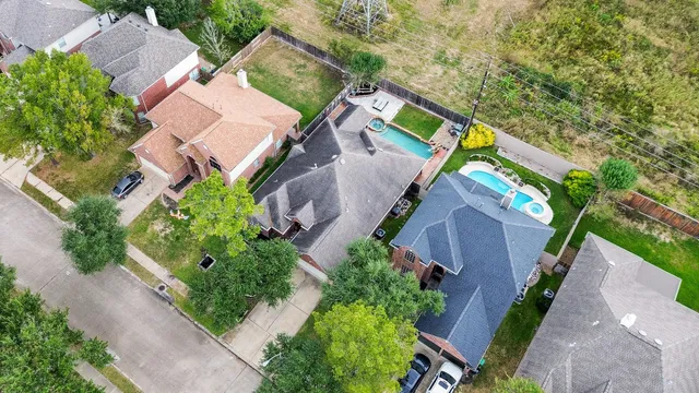 an aerial view of a house with outdoor space