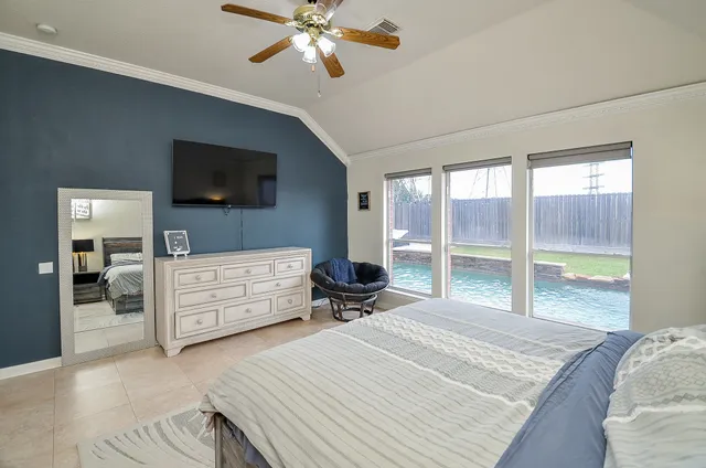 a bathroom with a granite countertop sink a toilet a mirror and shower