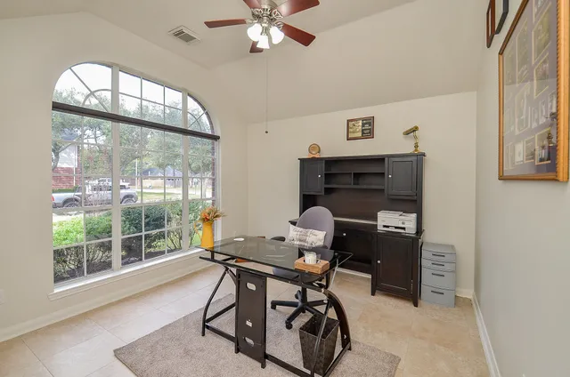 a bathroom with a granite countertop sink mirror toilet and bathtub