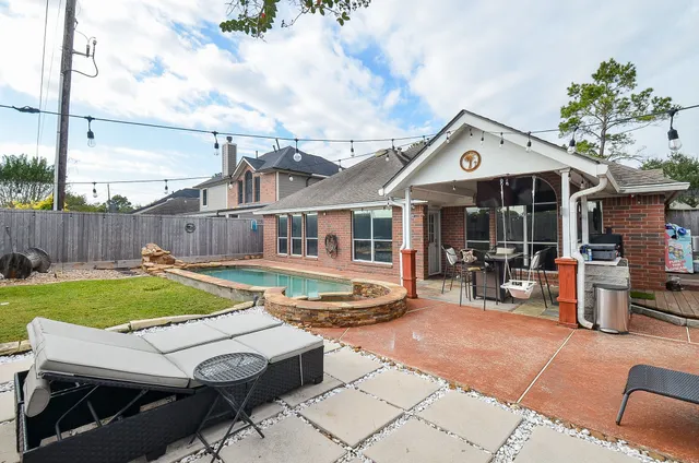 a view of a swimming pool with a sitting area