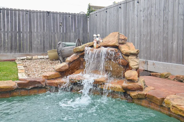 a view of a back yard of the house