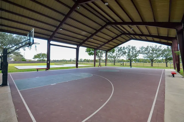a view of a house with swimming pool and sitting area