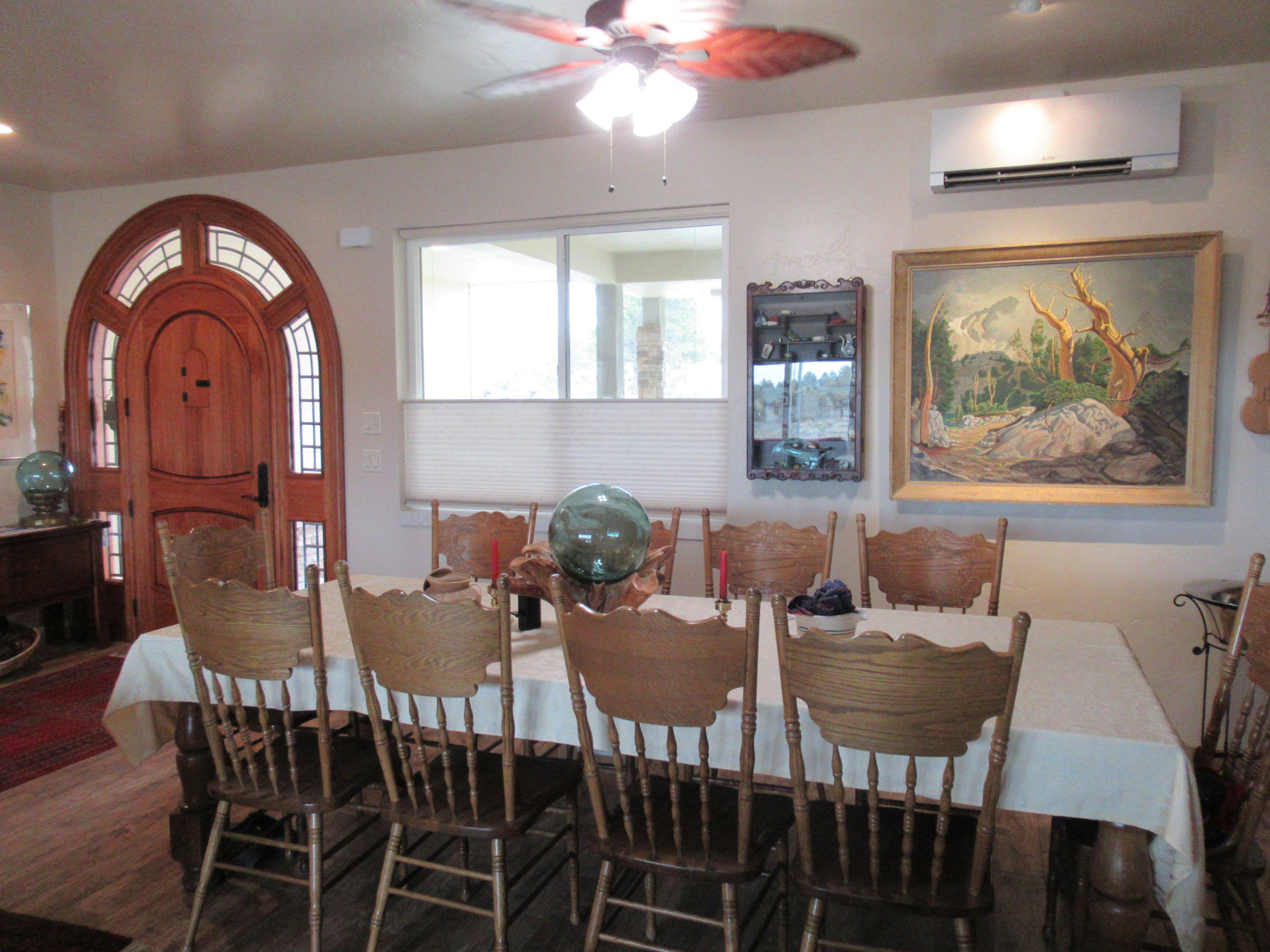 22063 Rickard Road Bend, OR 97702 - Photo 7 of 29 Front door and dining area. Dining area has built-in china hutch, with glass doors.