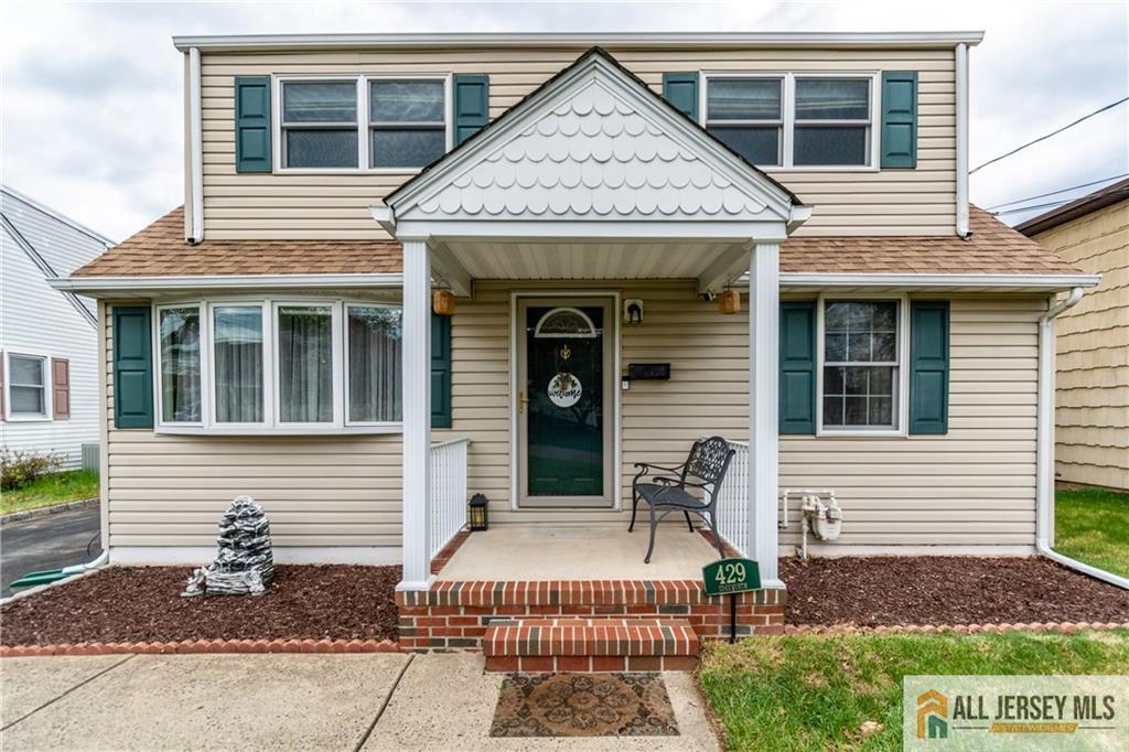 429 Edgeworth Street Middlesex, NJ 08846 - Photo 1 of 23 a view of a house with small windows and a yard