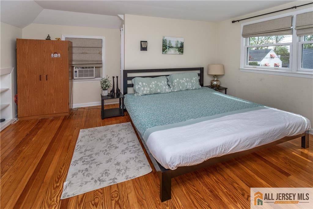 429 Edgeworth Street Middlesex, NJ 08846 - Photo 15 of 23 a bedroom with a bed and wooden floor