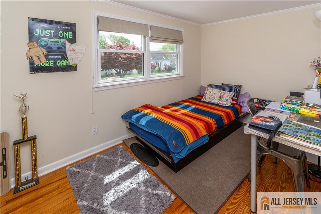 429 Edgeworth Street Middlesex, NJ 08846 - Photo 16 of 23 a bedroom with a bed and a window