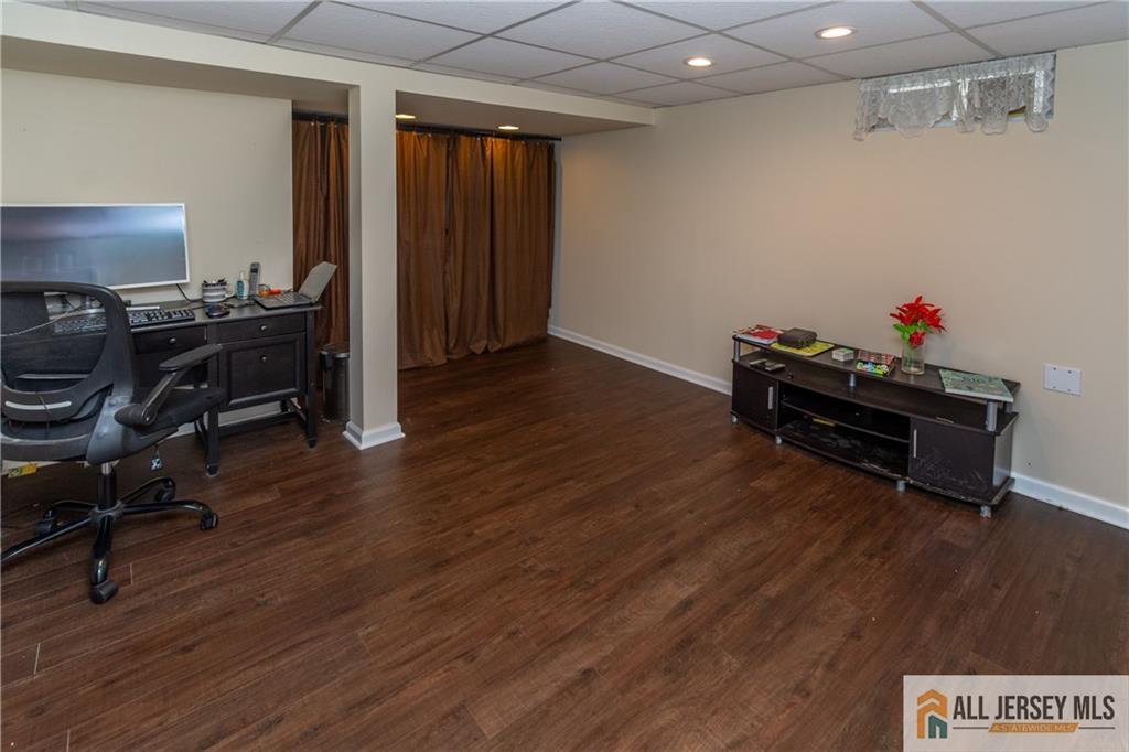 429 Edgeworth Street Middlesex, NJ 08846 - Photo 19 of 23 a room with wooden floor and furniture