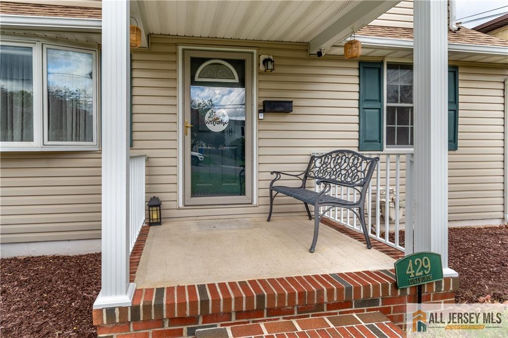 429 Edgeworth Street Middlesex, NJ 08846 - Photo 2 of 23 a balcony with table and chairs and potted plants
