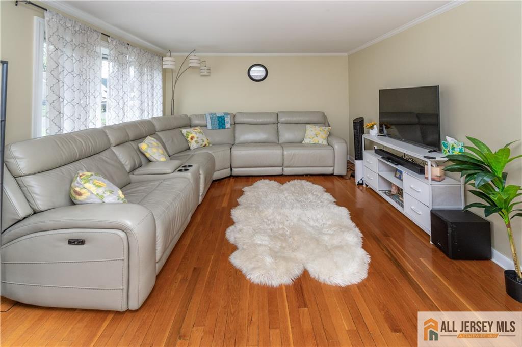 429 Edgeworth Street Middlesex, NJ 08846 - Photo 4 of 23 a living room with furniture and a flat screen tv