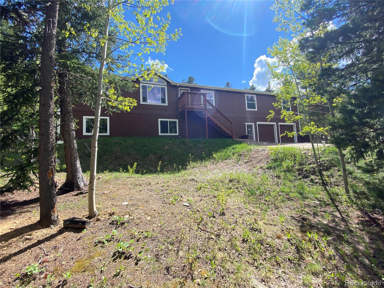 120 Blue Spruce Road Black Hawk, CO 80422 - Photo 26 of 27 a house view with a backyard space