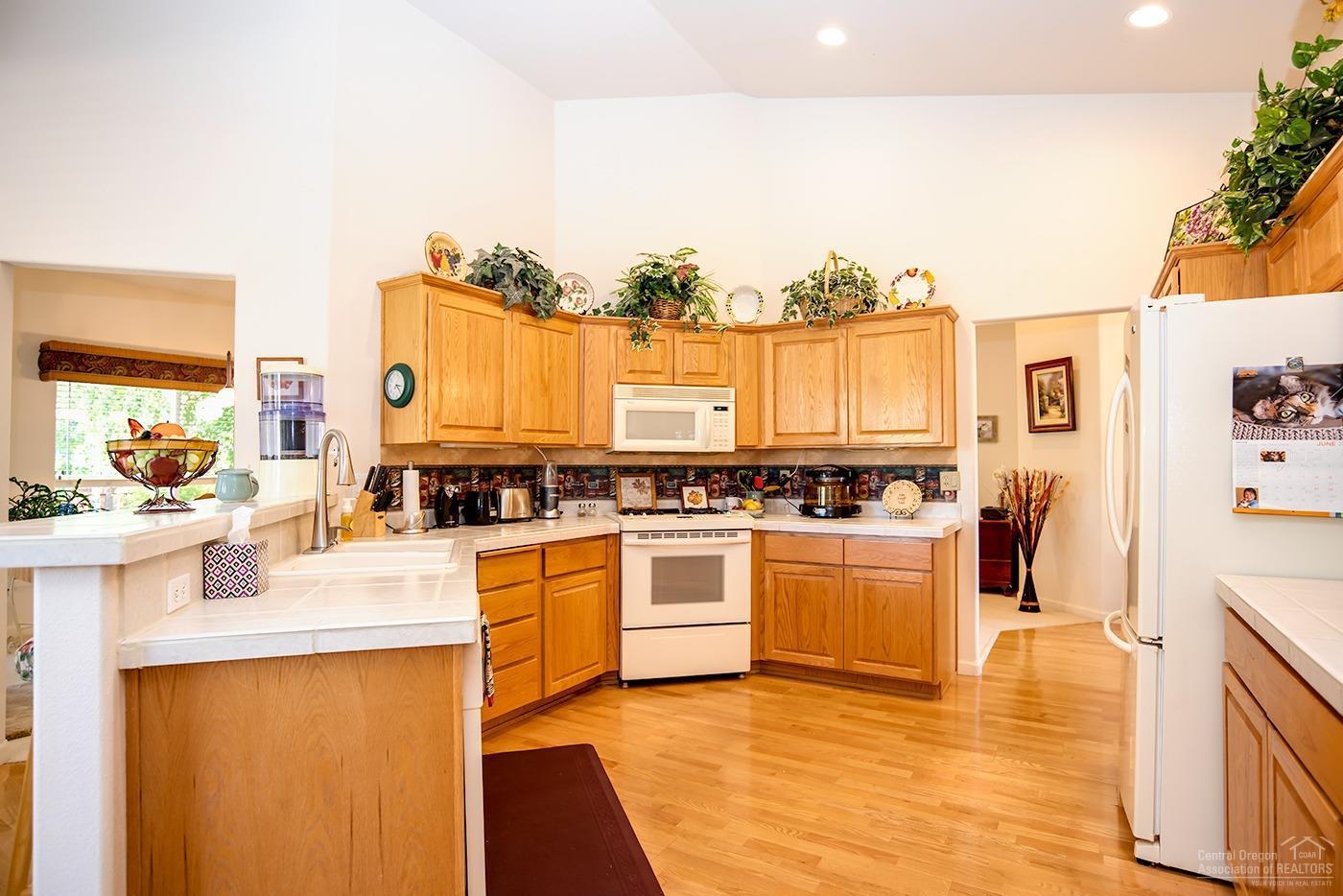 19883 Powers Road Bend, OR 97702 - Photo 7 of 25 Large kitchen with tile counter tops.