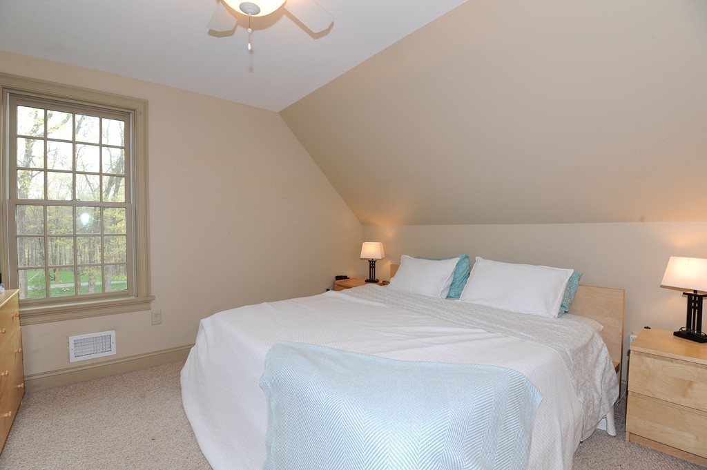 265 Leverett Road Amherst, MA 01002 - Photo 17 of 30 a bedroom with a bed and a window