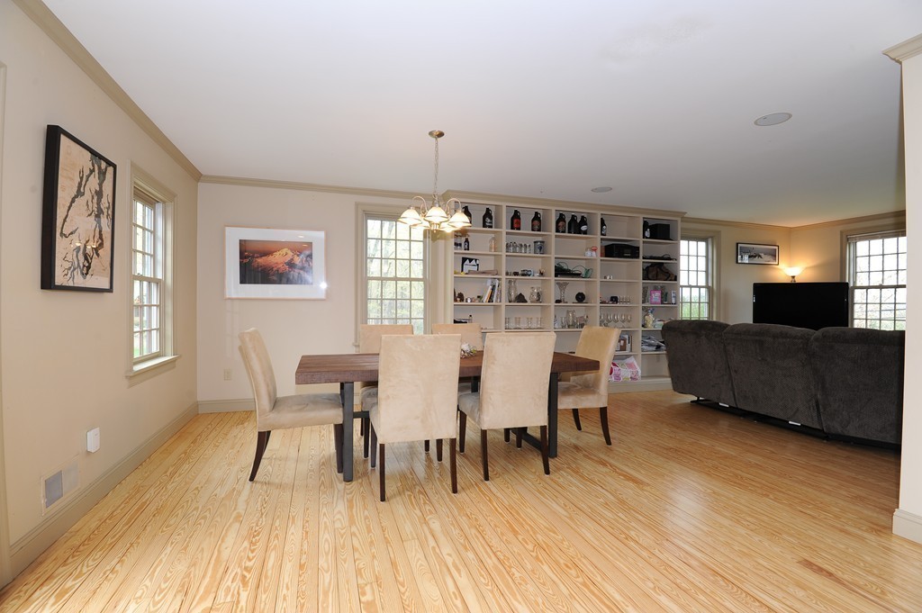 265 Leverett Road Amherst, MA 01002 - Photo 9 of 30 a view of a dining room with furniture and wooden floor