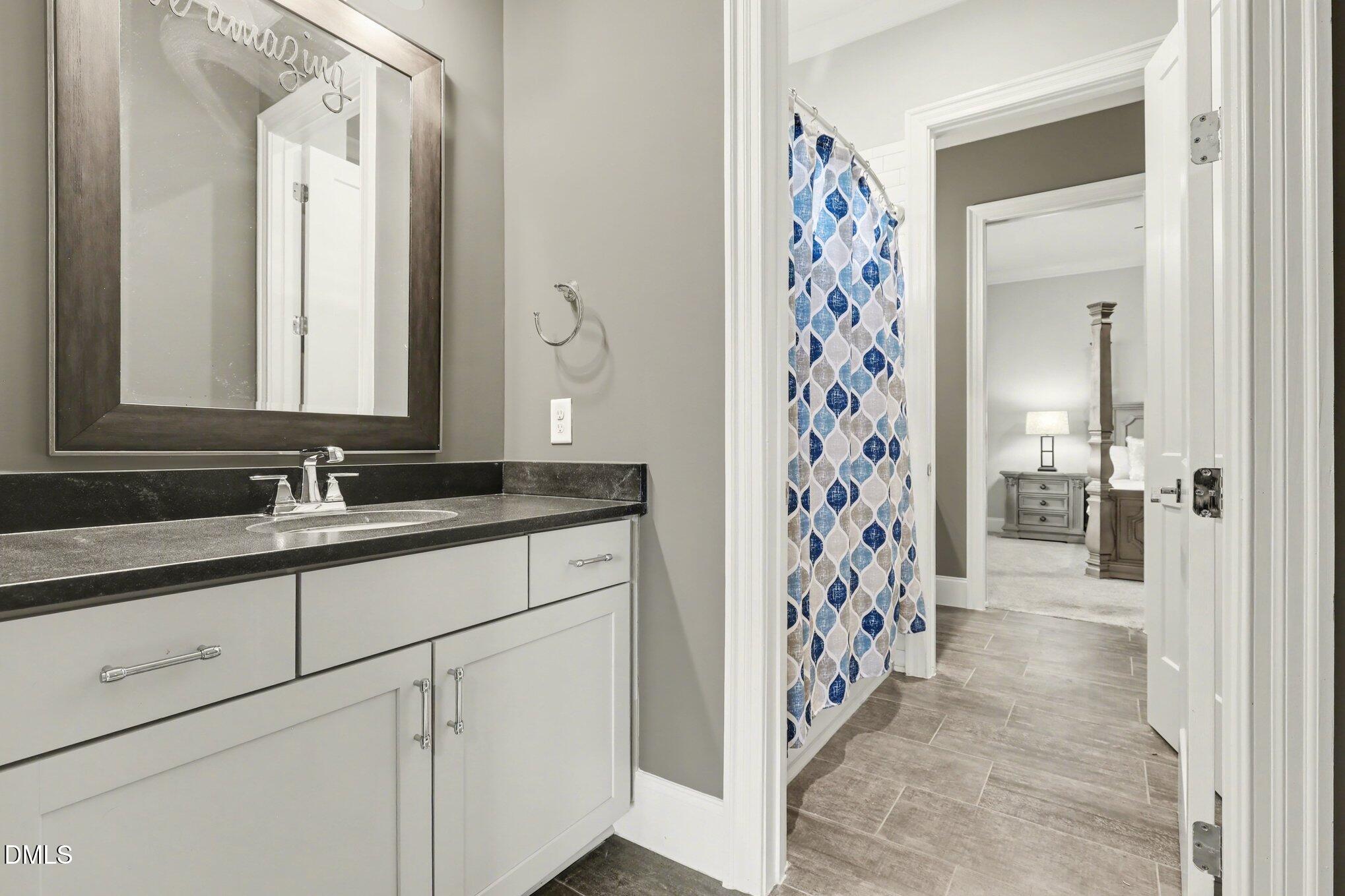 7433 Sextons Creek Drive Raleigh, NC 27614 - Photo 11 of 20 a bathroom with a sink and a mirror
