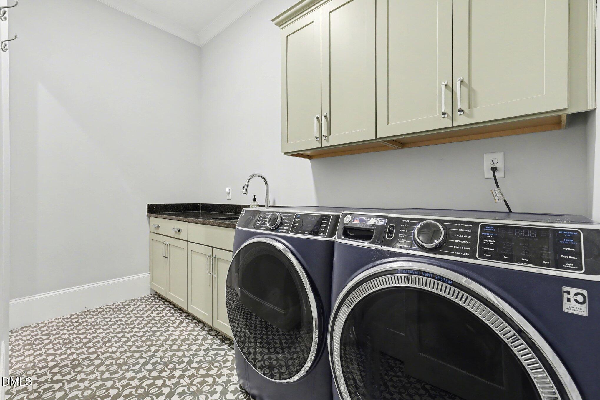 7433 Sextons Creek Drive Raleigh, NC 27614 - Photo 14 of 20 a utility room with dryer and washer