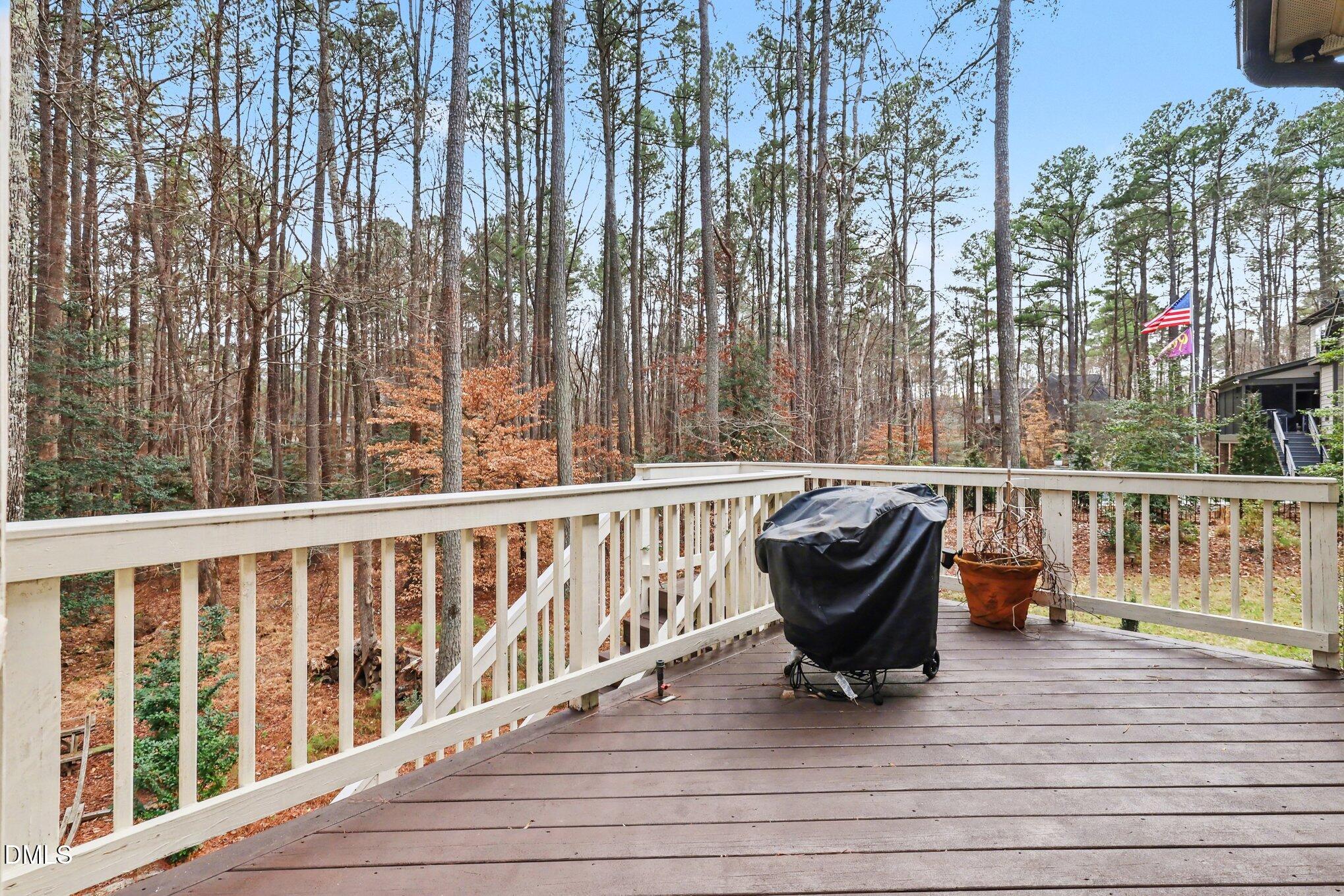 7433 Sextons Creek Drive Raleigh, NC 27614 - Photo 18 of 20 a view of a chair and table on the wooden floor