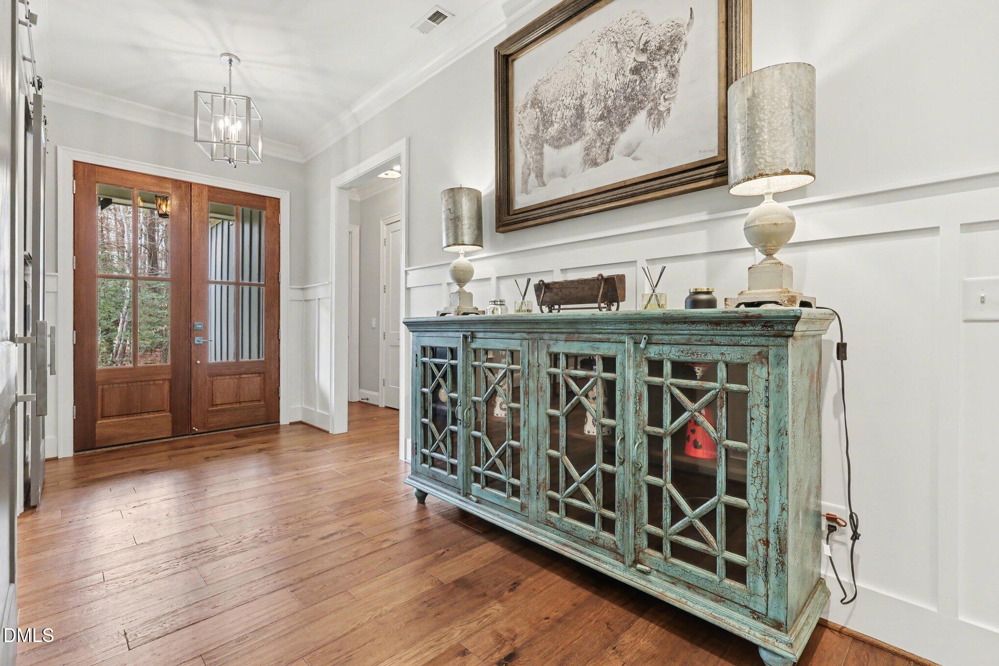 7433 Sextons Creek Drive Raleigh, NC 27614 - Photo 2 of 20 a view of an entryway with wooden floor