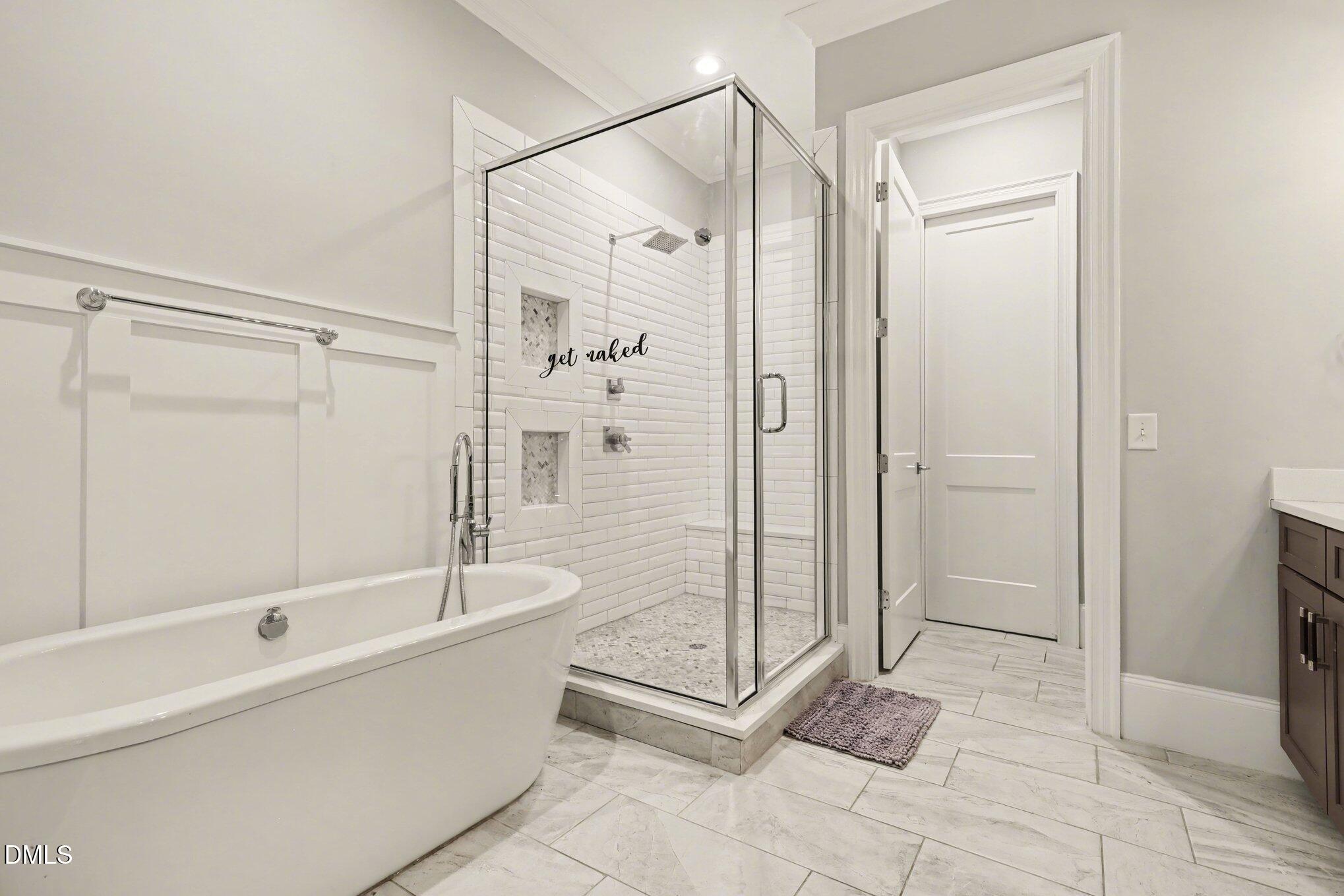 7433 Sextons Creek Drive Raleigh, NC 27614 - Photo 8 of 20 a bathroom with a shower and a tub