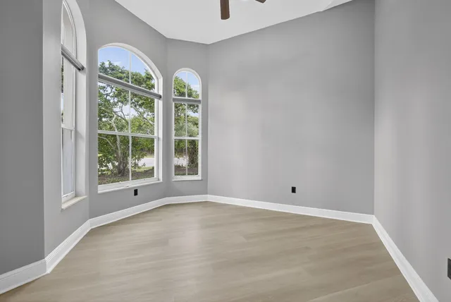a view of an empty room with a window