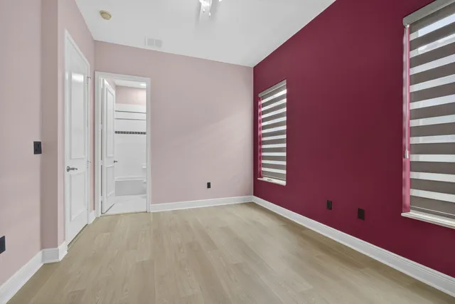 a view of an empty room with windows