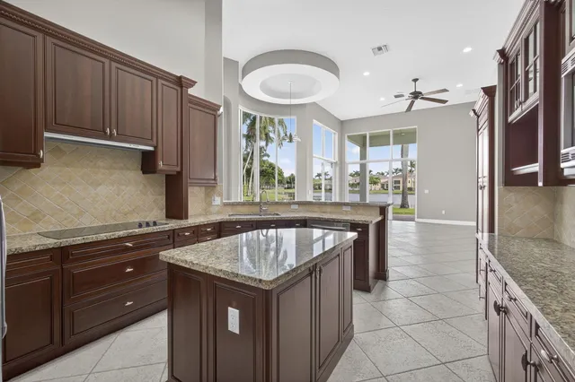 a view of empty room with ceiling fan