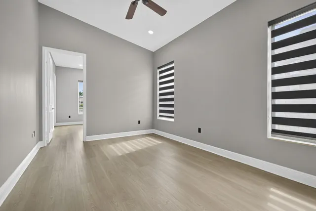 a view of a house with a backyard and a patio