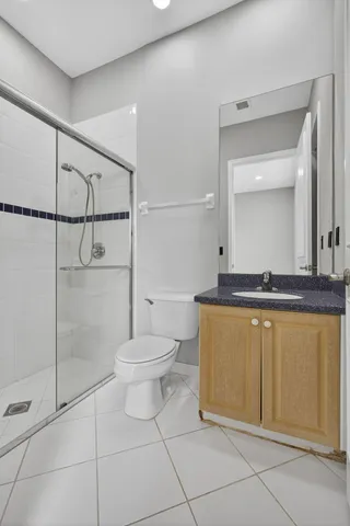 a view of a yard with a lake and palm trees