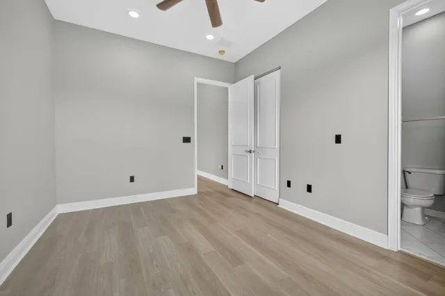 an aerial view of residential houses with outdoor space and swimming pool