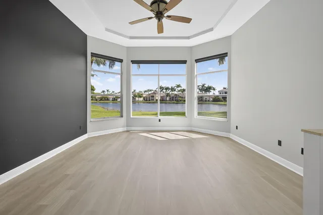 an aerial view of a house with a lake