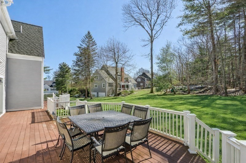 11 Thaxton Road Beverly, MA 01915 - Photo 35 of 40 a view of a wooden dinning table and chairs in the patio